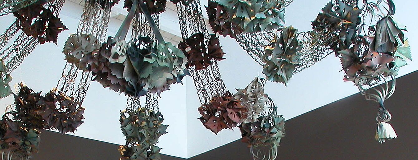 Jane Benson, “hanging bush”, 2004, foil garlands & spray paint, dimensions variable